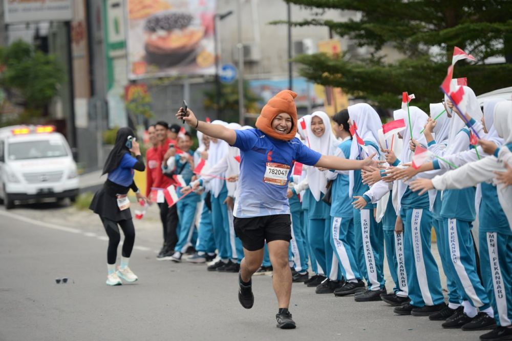 Diah Rahmawati dan Ali dari Palembang Mengaku Puas Ikut Riau Bhayangkara Run 2024